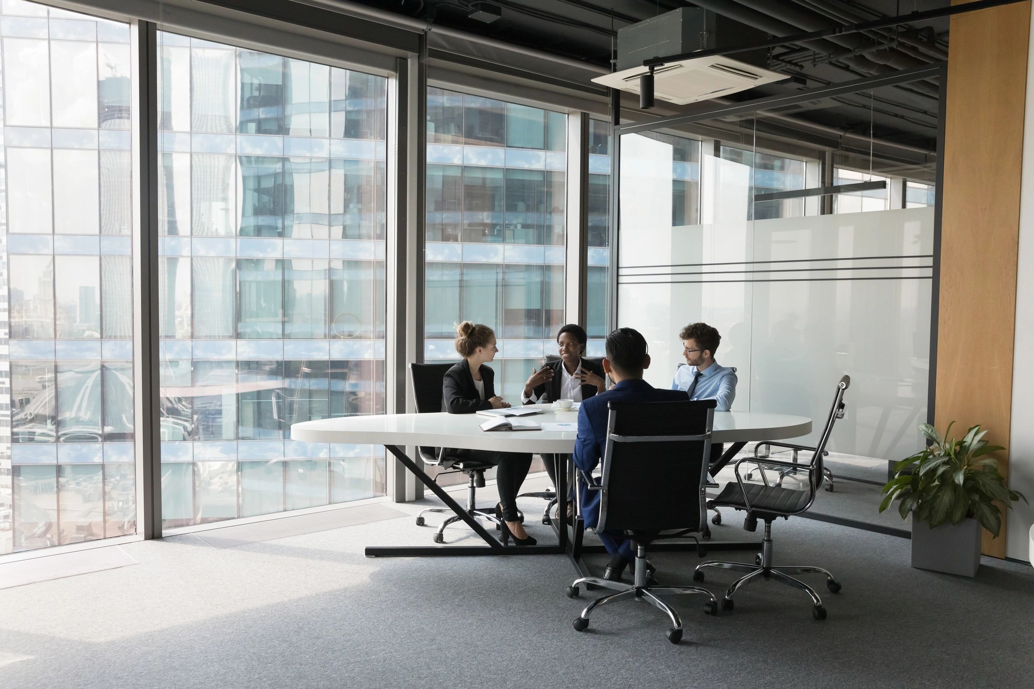 Professional team meeting in a modern office for HR consultancy planning