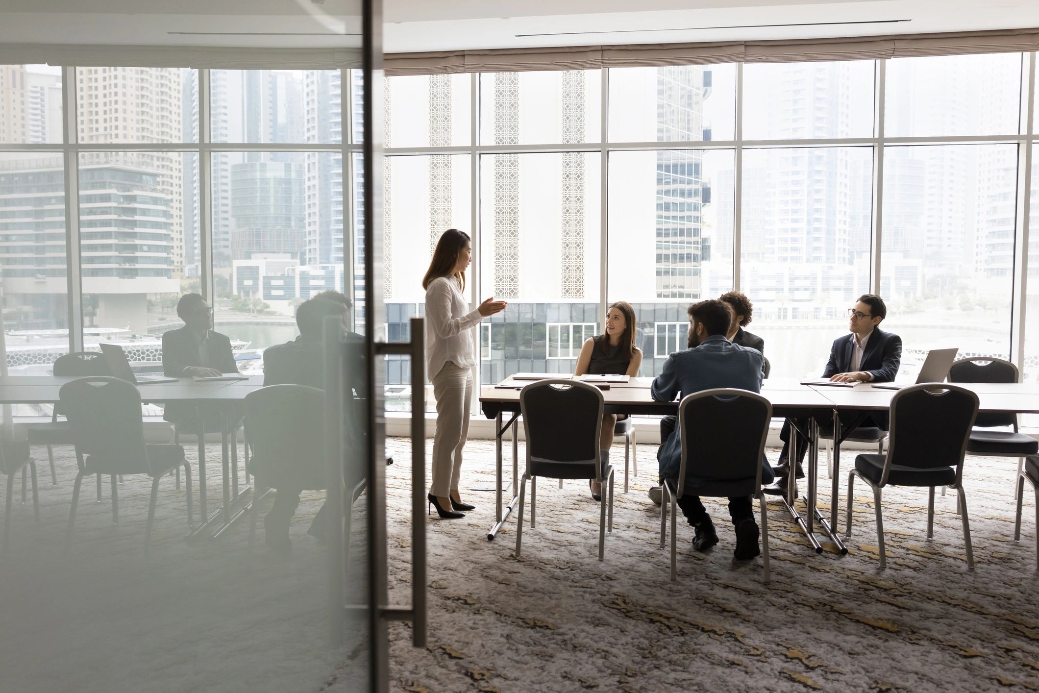 Business team in discussion around a meeting table