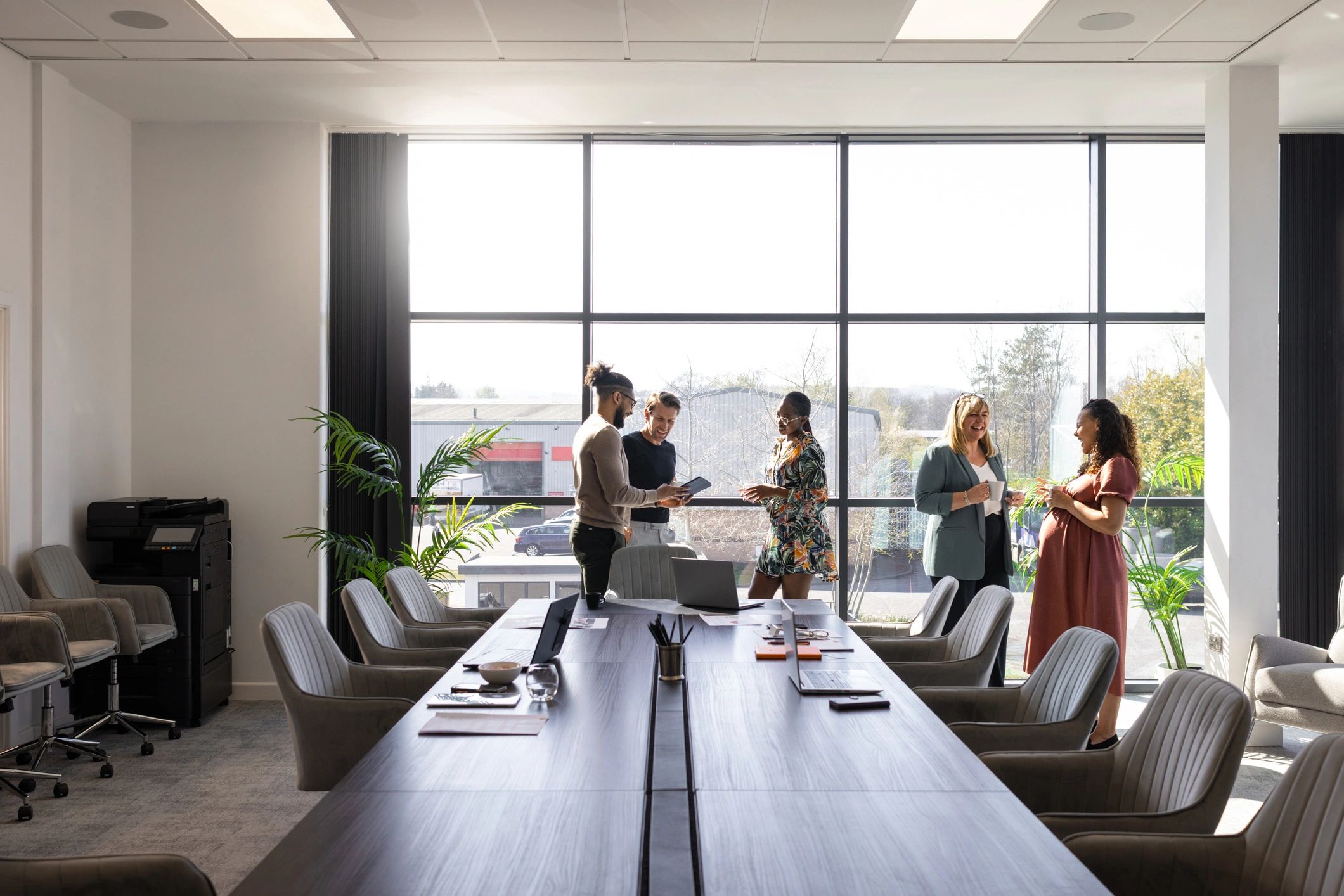 Business colleagues in a modern office discussing leadership and people strategy
